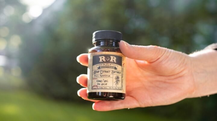 cbd oil benefits - Person incorporating CBD oil into morning wellness routine