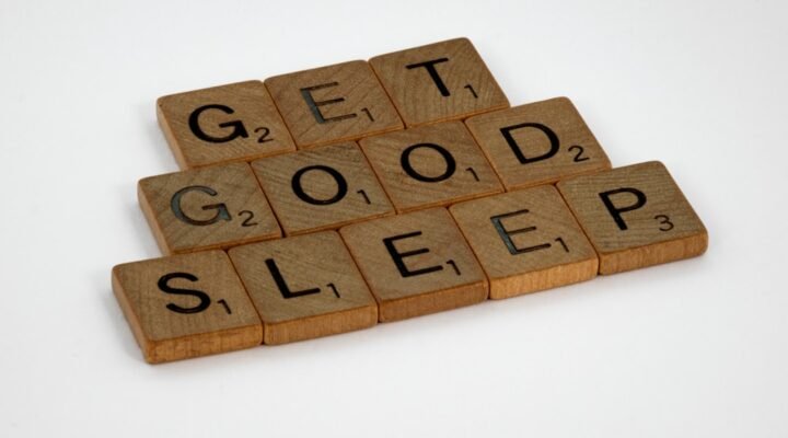 brown wooden letter blocks on white surface