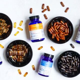 blue and white plastic bottle beside brown round ashtray