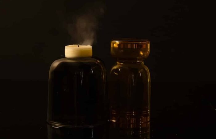 Premium high strength CBD oil bottles arranged with natural hemp leaves, representing quality wellness support