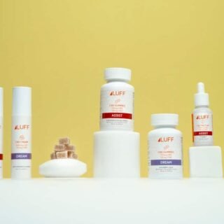 A curated selection of premium CBD topical creams and balms arranged on a clean, modern surface