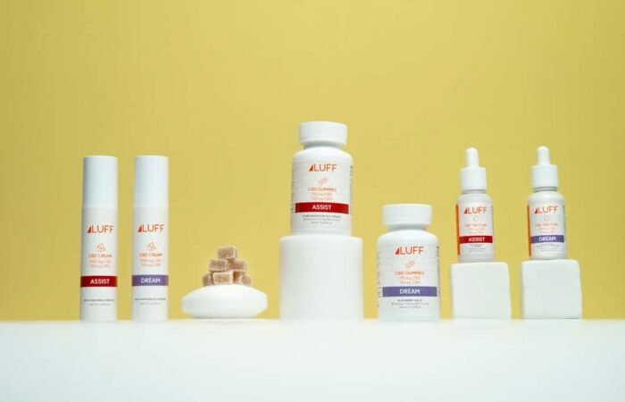 A curated selection of premium CBD topical creams and balms arranged on a clean, modern surface