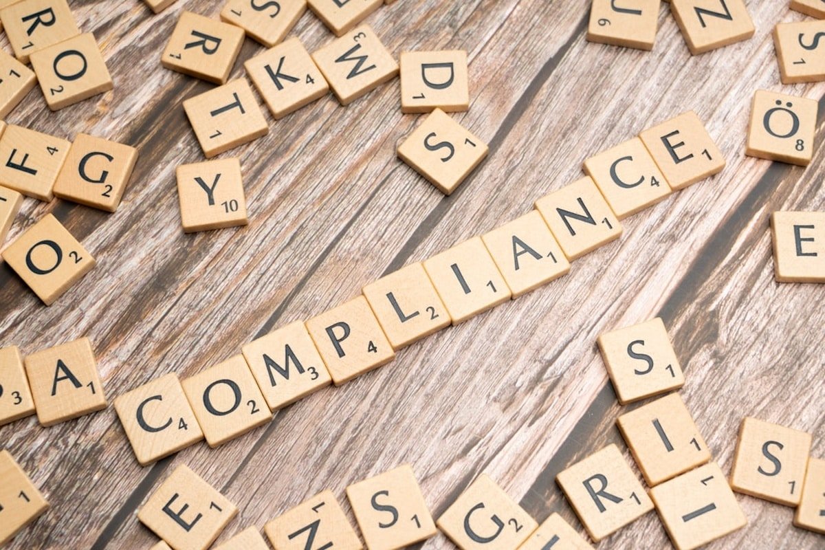 novel food cbd uk - Person checking FSA website on laptop to verify CBD product compliance