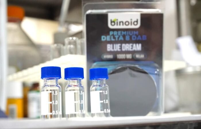 cbd product transparency uk - A certified laboratory analyst reviewing CBD batch test results — the gold standard of produ...