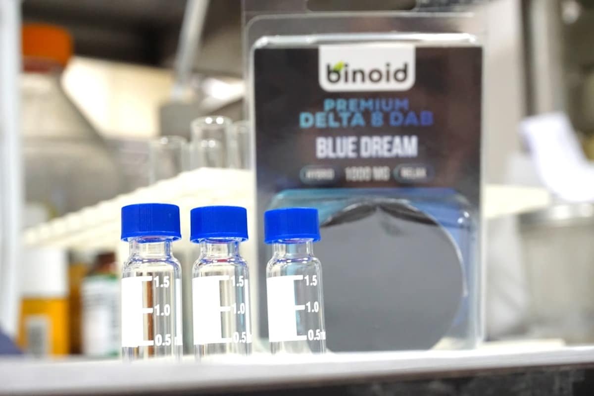 cbd product transparency uk - A certified laboratory analyst reviewing CBD batch test results — the gold standard of produ...