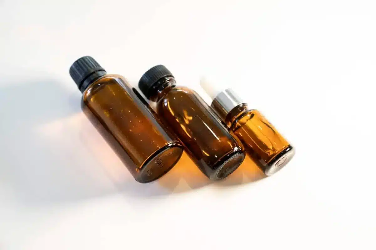 Three amber glass dropper bottles